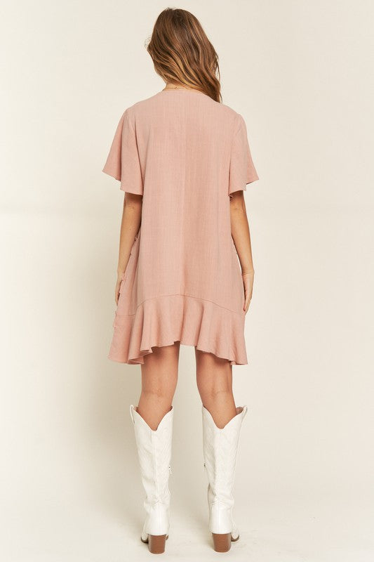 Back view of Gentry Tiered Ruffle Mini Dress in mauve showing ruffle tiers and relaxed fit.