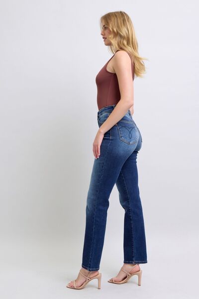 Full body side view of Carson Straight Leg Jeans in dark wash, showing mid rise and slim straight cut.