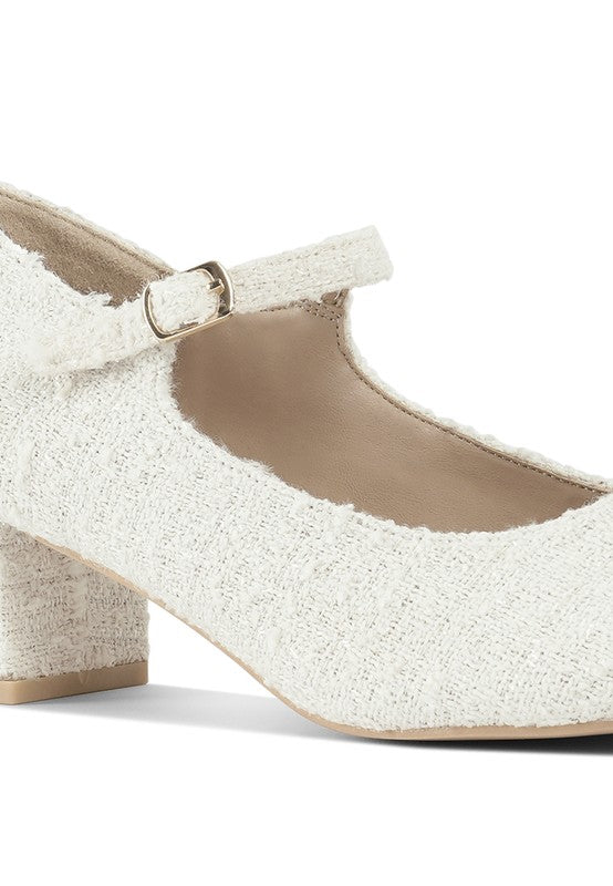 Close-up of White Antara Tweed Mary Jane Heels showing tweed fabric texture and ankle strap.