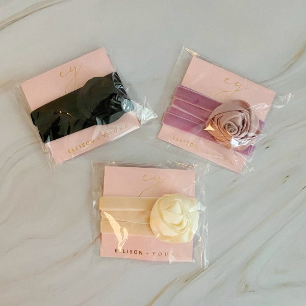 Satin Rose Velvet Sash Necklaces packaged in Ellison + Young branding