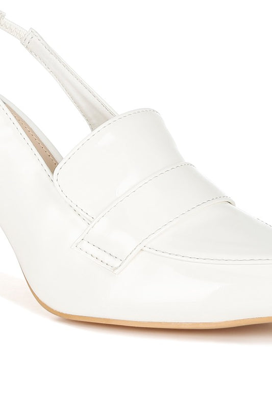 Close-up of White Voisin Slingback Loafer Heels highlighting vamp strap and patent texture.