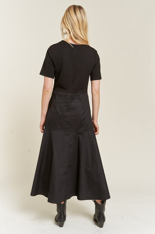 Back view of Felicity Knit Mix Dress in black showing cotton skirt and clean seam lines