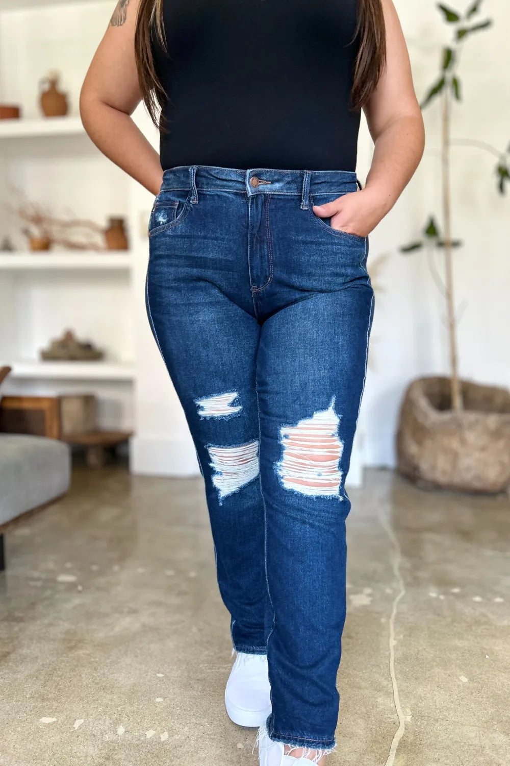 Plus size model styled in Wynna High Waist Straight Jeans, raw hem and edgy distressing