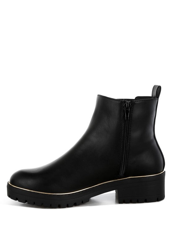 Inside side view of black Antorin chunky buckle ankle boots highlighting zipper and gusset.