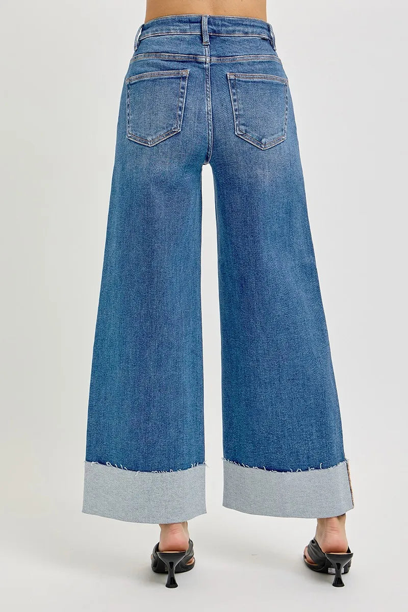 Medium wash Sylvi wide cuff jeans with high rise tummy control and cropped wide leg.