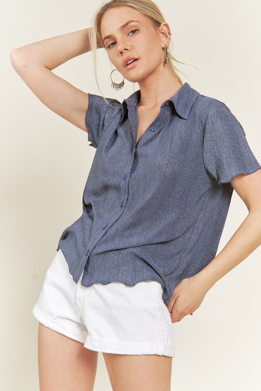 Denim blue plus size collared shirt with short sleeves, relaxed fit.