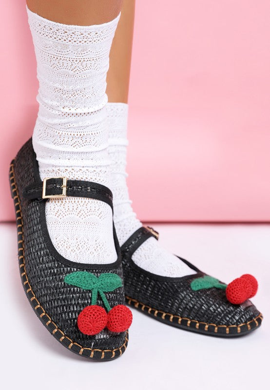 Front view of black Brunch Date Mary Jane Flats with lace socks, featuring cherry embellishment and a classic round toe.