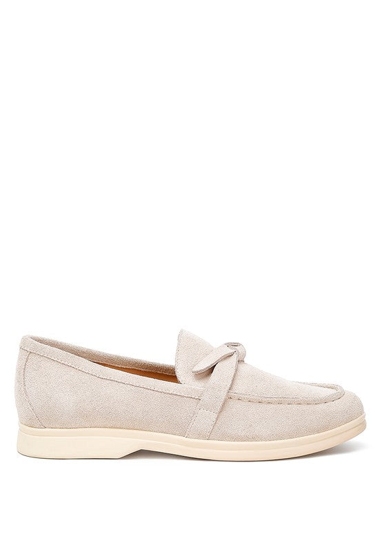 Side profile of Nautica beige suede loafers with rounded toe.