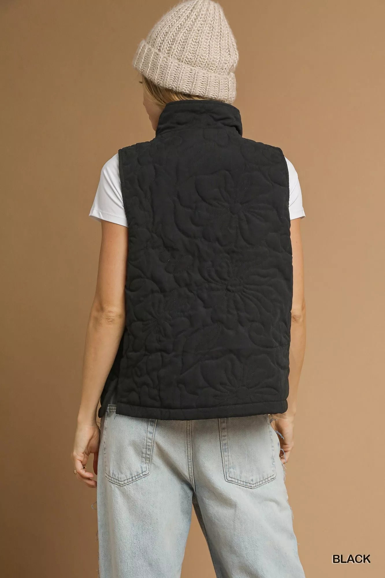 Noor Quilted Floral Vest in black with large floral quilted pattern, back view