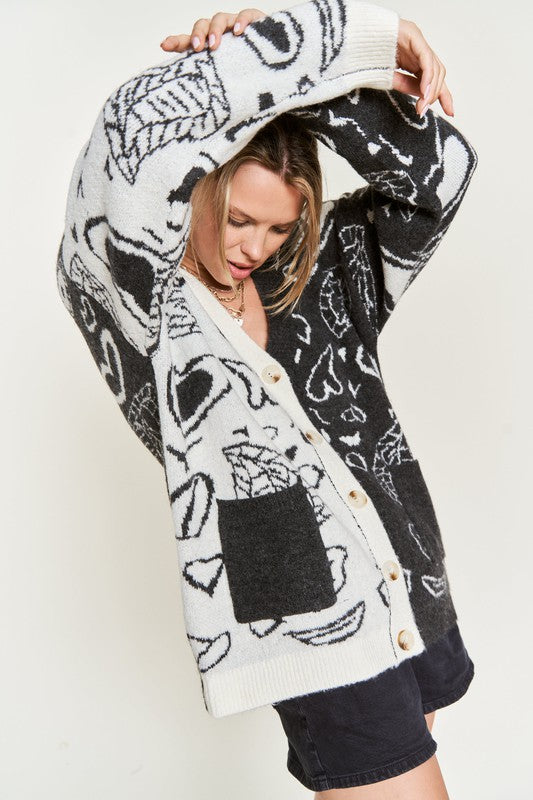 Charcoal Dafni Heart Paisley Cardigan front view with button-down detail, model wearing shorts.