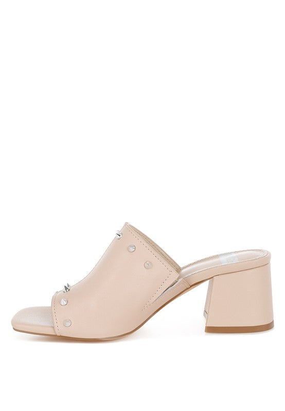 Elegant beige Lomela Stud Embellished Mules featuring a block heel, stud accents, open square toe, and plush cushion insole for comfortable, stylish wear.