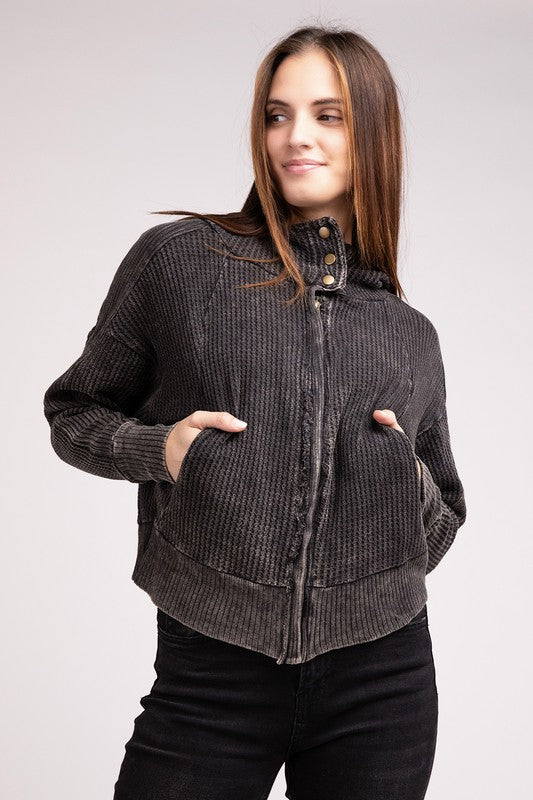 Front view of model wearing Ash Black Hanna Acid Wash Hooded Jacket with hands in pockets.