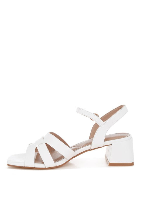 Side view of white Eliska Strappy Block Heels with ankle strap and buckle.