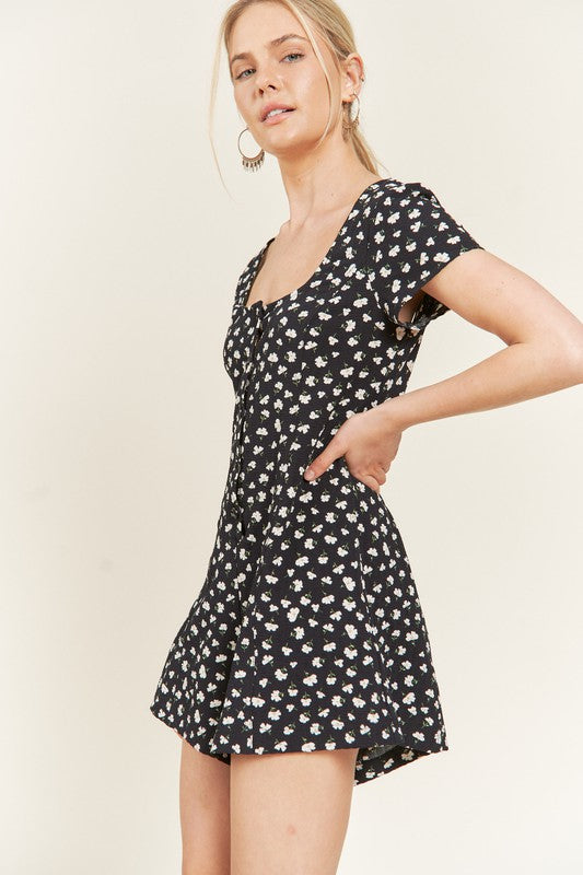 Side view of Xiomara Plus Size Floral Romper showing floral print, short sleeves, and button-down front.