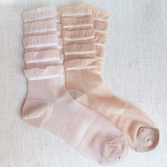 Full flat lay view of Tulle Lace Cascade Socks in pink and beige, one set of two.