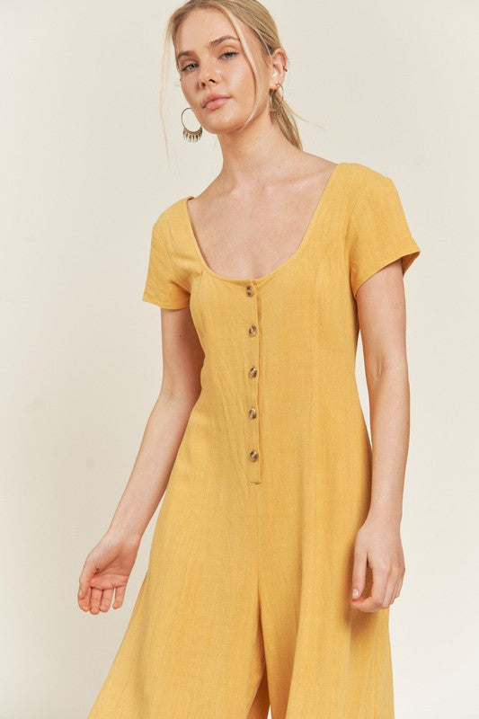 Mustard Seona Linen Plus Size Jumpsuit close up of button detail and linen-blend fabric texture.