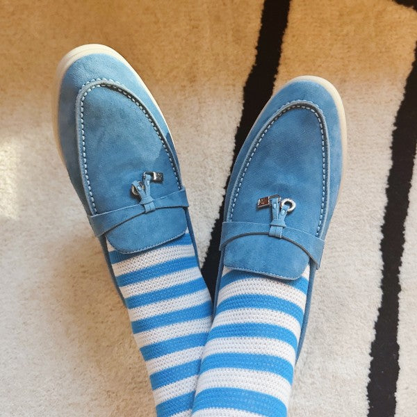Woman wearing blue and white striped Urban Stripes Socks styled with shoes.