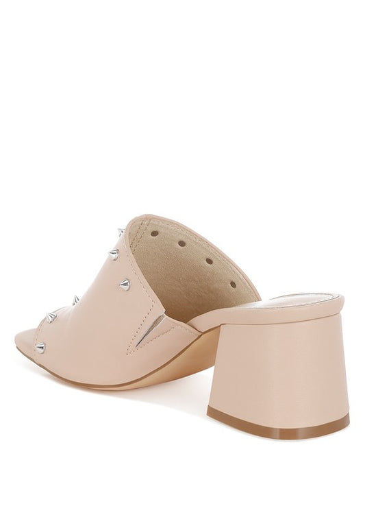 Inside back angle view of Lomela Stud Embellished Block Heel Mules in beige showing block heel and stud accents.