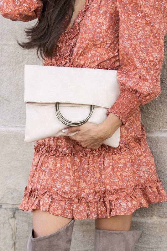 Bone Safara Fold-Over O-Ring Clutch in soft vegan leather with antique bronze hardware.