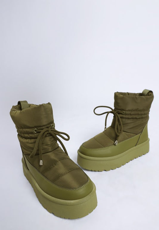 Close-up of khaki green Pacos Chunky Snow Boots on white background.