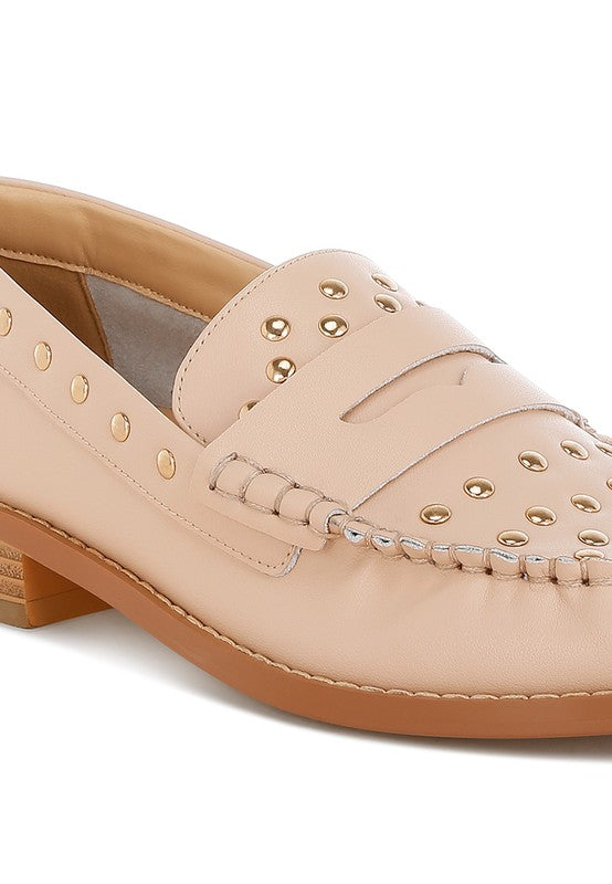 Close-up of Beige Oglavia Studded Leather Loafers showing stud embellishments and mock stitching.