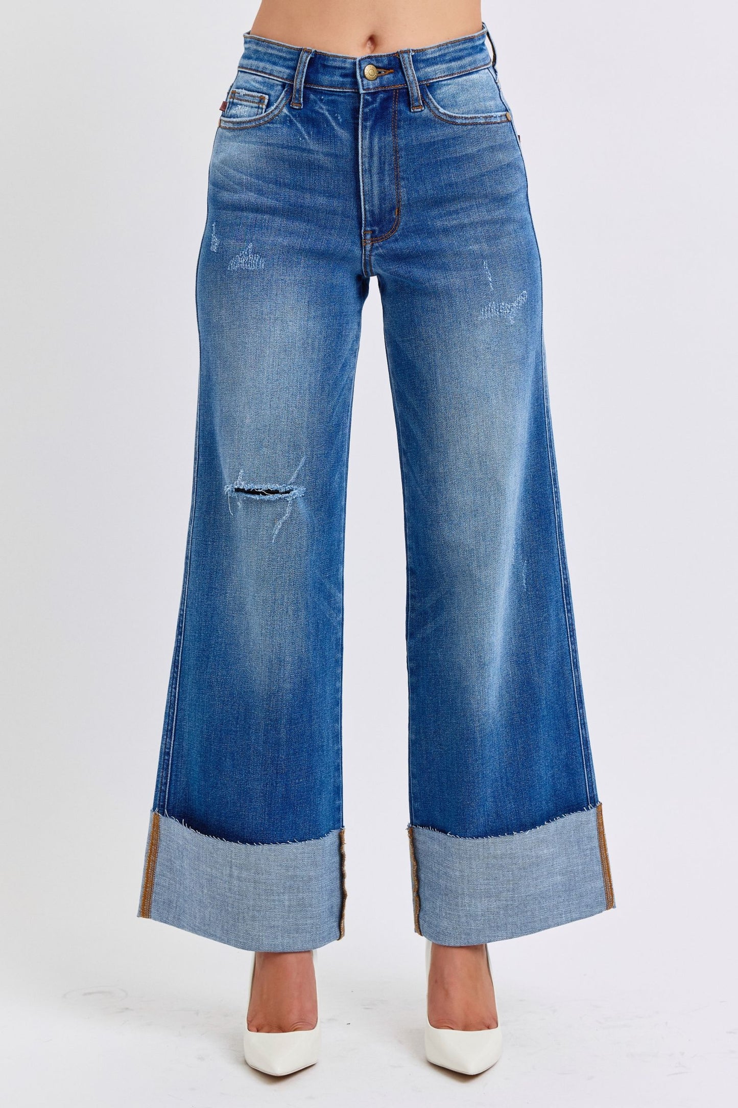 Plus size Judy Blue Nare Wide Leg Jeans, high-waist distressed denim paired with heels and long sleeve top.