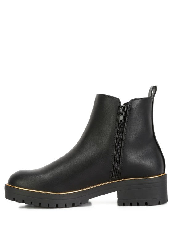 Side view of Black Thorin Block Heel Boots showing zipper closure and lug sole design.