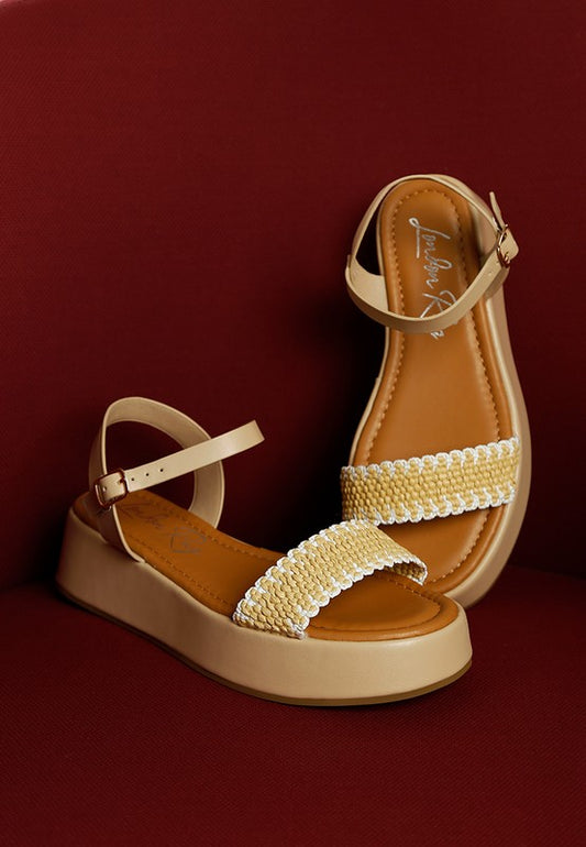Beige Anglong Raffia Flatform Sandals with natural woven texture and supportive flatform heel.