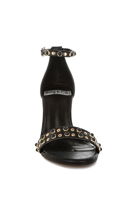 Black genuine leather studded wedge sandals front view.