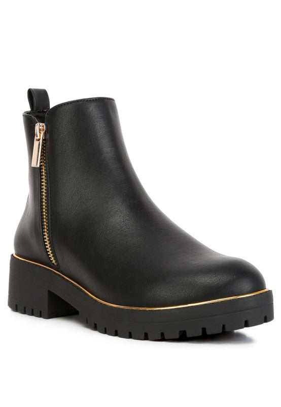 Front angle view of Black Thorin Block Heel Boots with metallic zipper closure and lug sole.