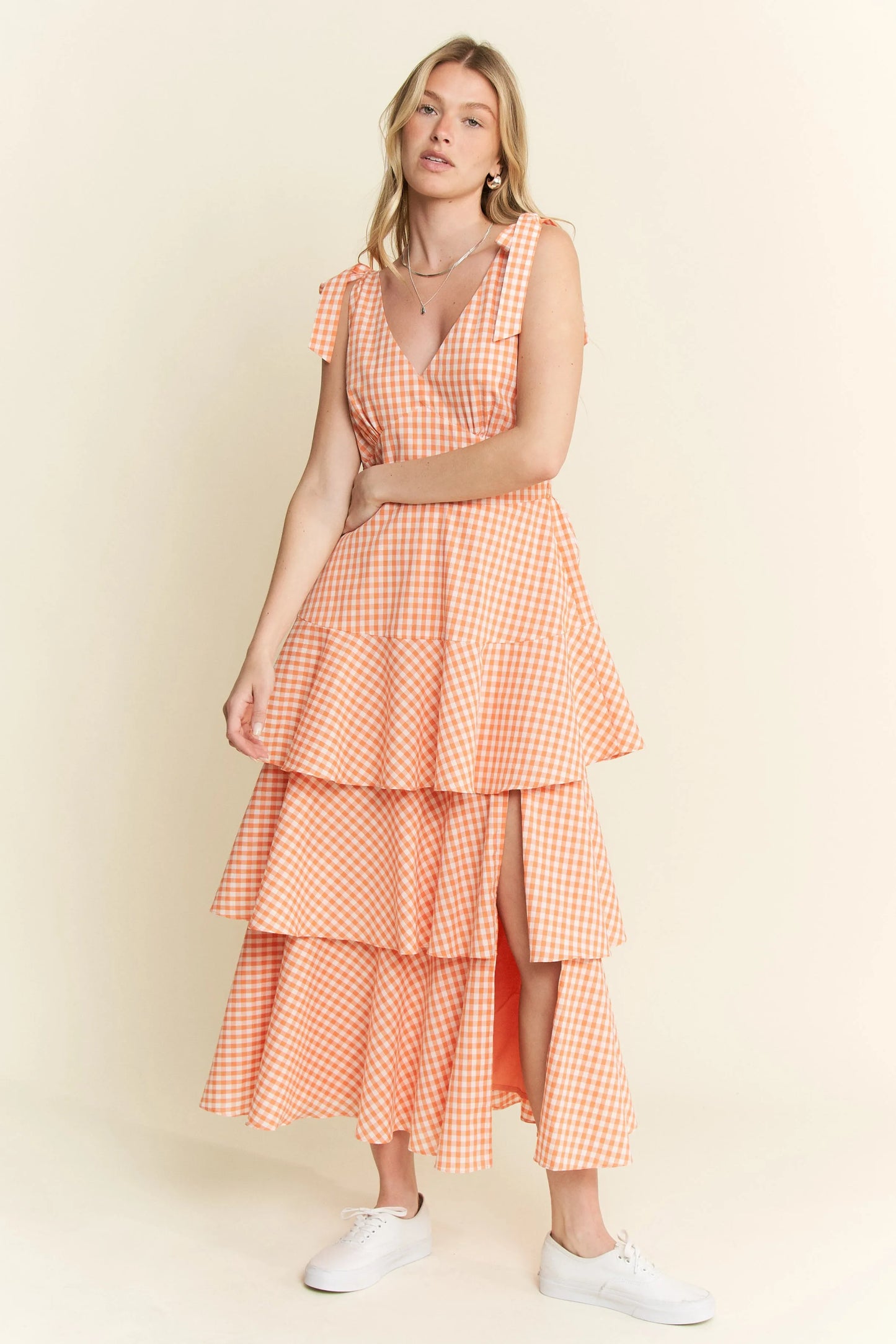 Front view of Alice Gingham Tiered Midi Dress by Jade by Jane, showing green and white gingham print, V-neckline, and ruffled tiered skirt with slit.
