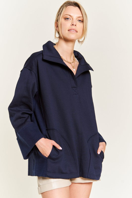 Aylani Plus Size High Collar Knit Top navy front view raw edge detail