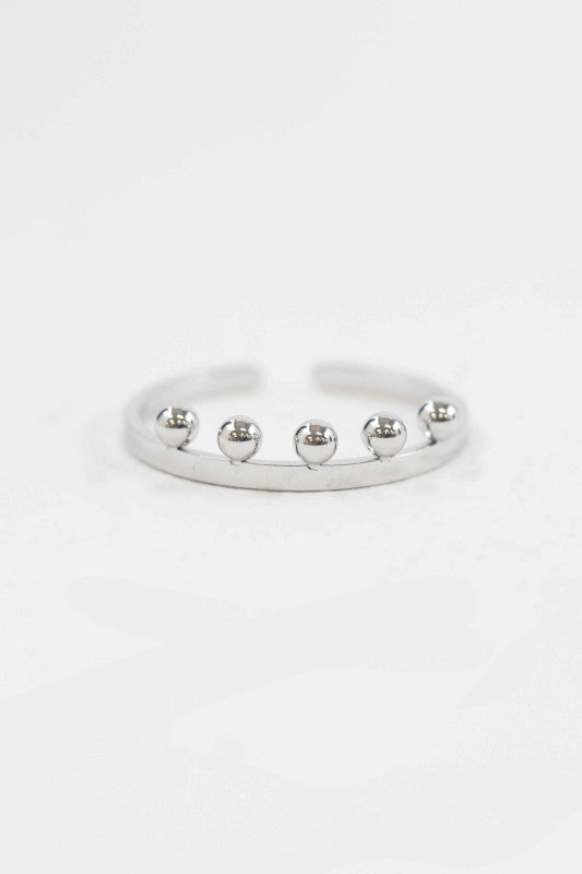 Top view of Bump Adjustable Ring in silver with ball charm accents