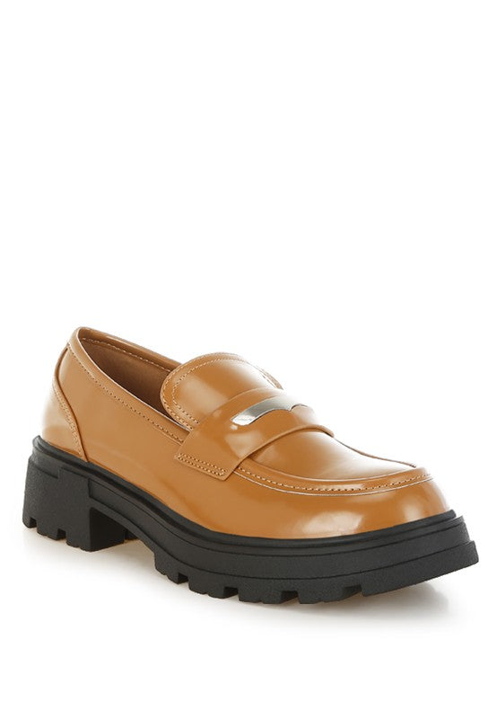 Front angled view of Tan Gleam Stride Chunky Loafers with metallic penny strap and lug sole.