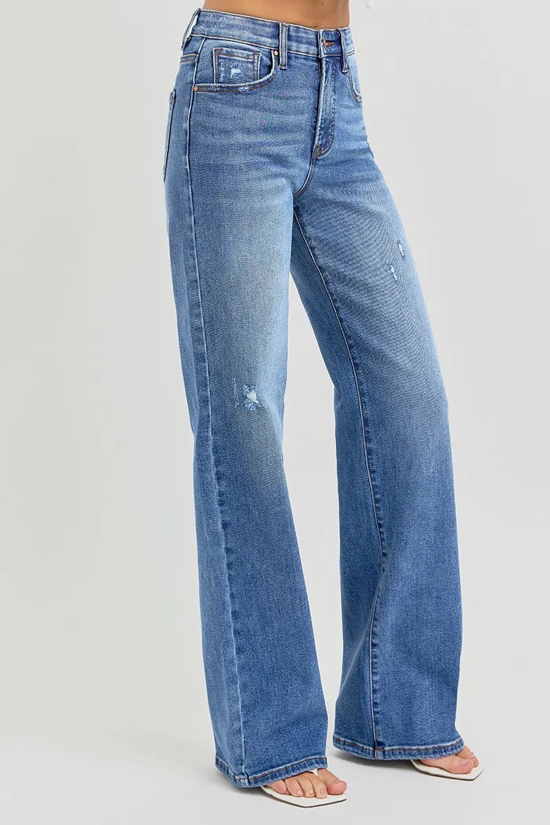 Side profile of Allyson tummy control wide leg jeans, showing relaxed fit through hips and leg, styled with sandals.