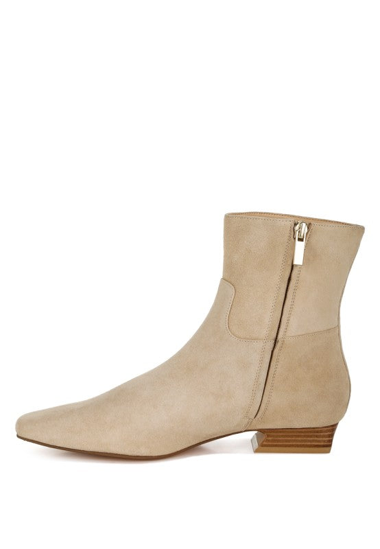 Side inside view of beige Hakra suede bootie showing inner zipper closure and sleek panel design.