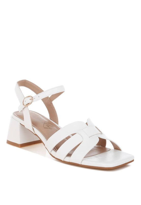 Front angle of white Eliska Strappy Block Heels with square toe design.