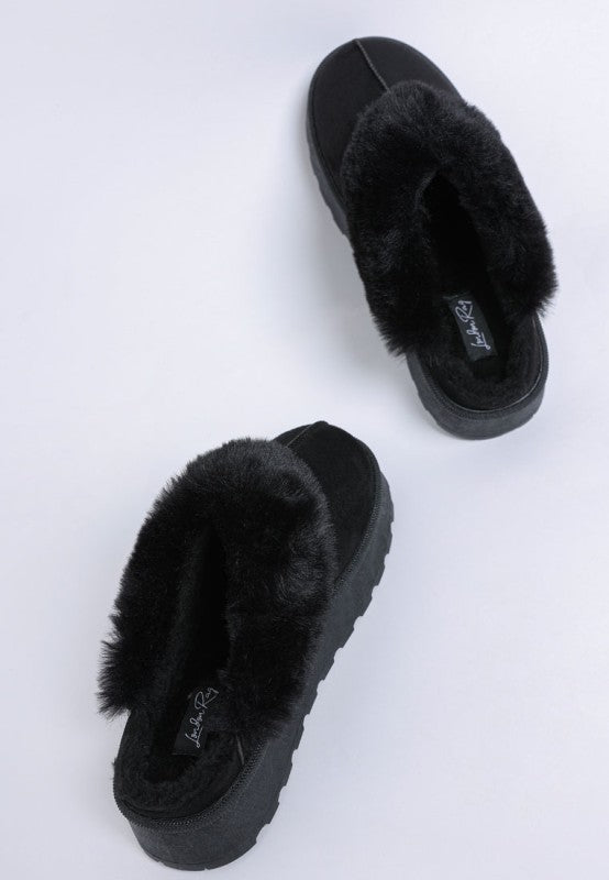 Black Portho Faux Fur Slip Ons with soft faux fur detail and flatform heel on white background.