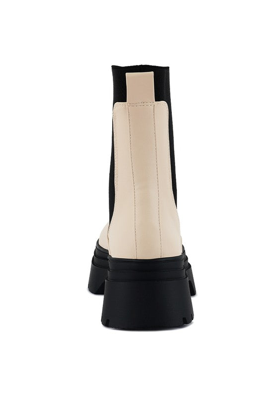Back of Ronin ecru Chelsea boot with tall gusset and pull tab detail.