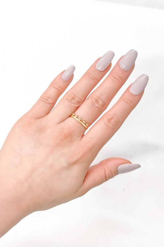 Bump Adjustable Ring gold adjustable band on woman’s hand