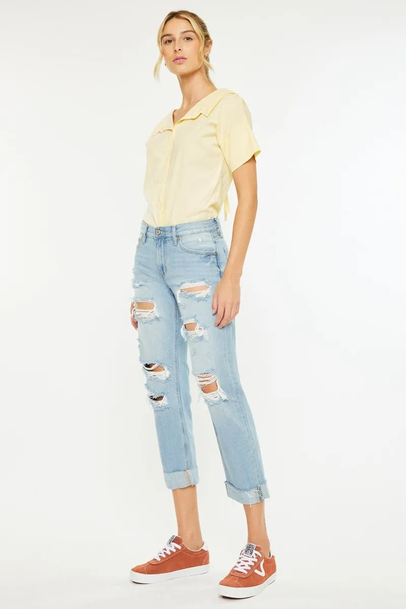 Side view of Cordelia Mid Rise Boyfriend Jeans with relaxed fit, distressed detailing, and classic medium wash denim.