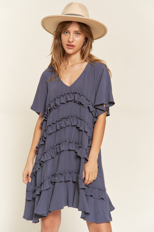 Front view of Gentry Tiered Ruffle Mini Dress in cement with V-neck and flared short sleeves.