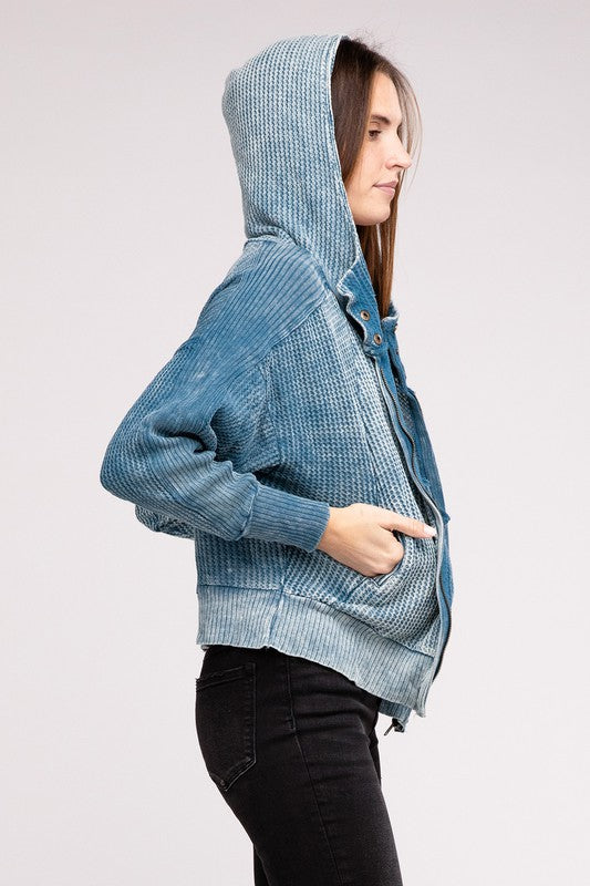 Model wearing Teal Hanna Hooded Jacket with hood up, showing relaxed style.