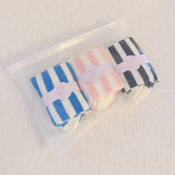 Packaged Urban Stripes Socks Set of 3 in blue, pink, and black striped pairs.