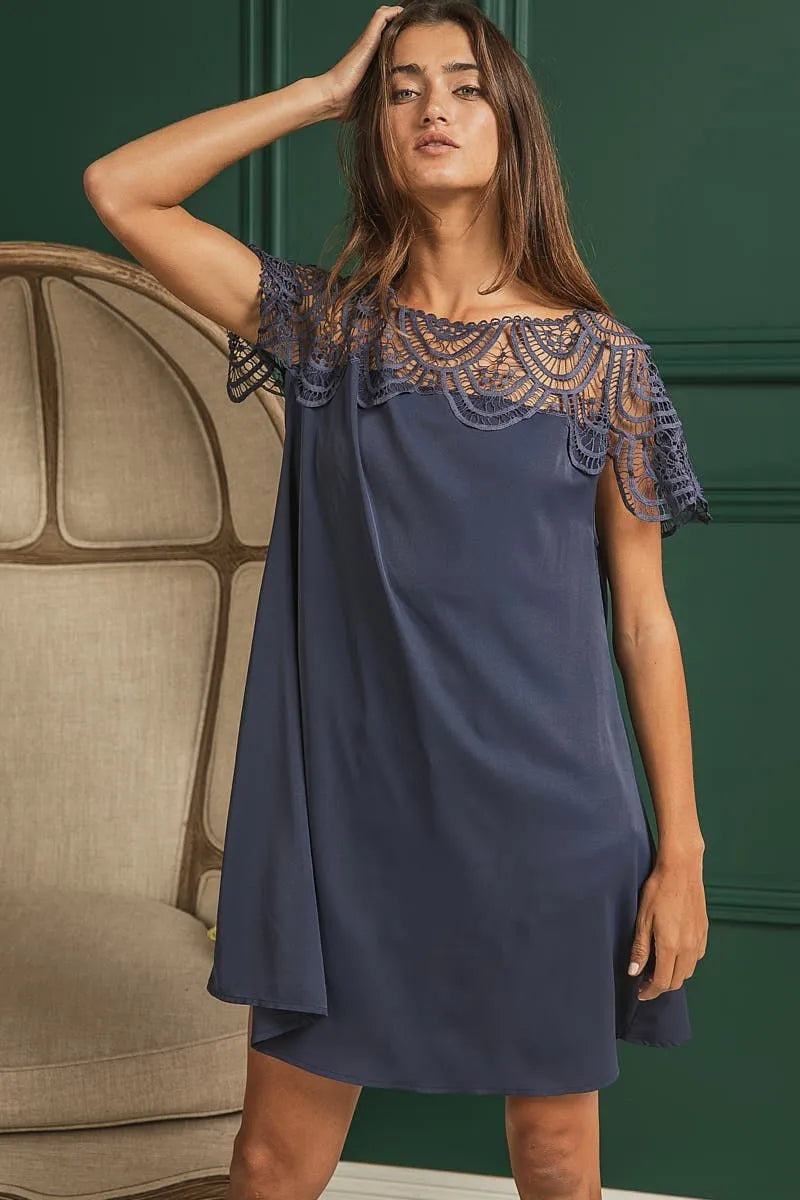 Model front view wearing Misty Navy Crochet Lace Dress with wrinkled texture.