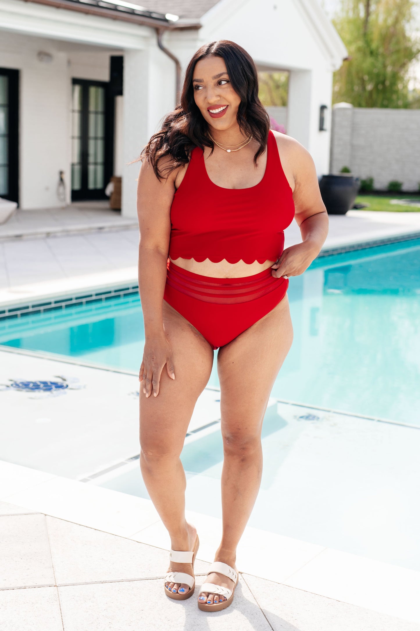 Red Tonga Scalloped Swim Top with a stylish criss-cross strap design, round neckline, built-in bra, and removable cups for a secure fit."