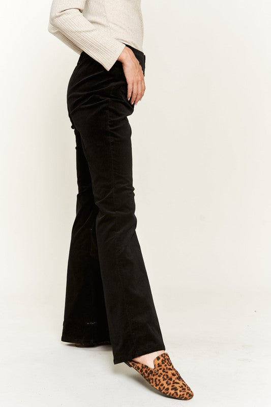 Side view of Taran Plus Size Corduroy Flare Pants in black highlighting flared silhouette