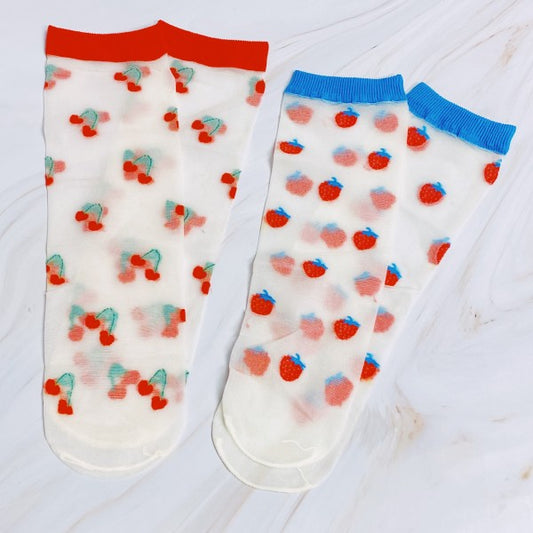 Flat lay of Sweet & Fruity Sheer Socks set with cherry pair in red and strawberry pair in blue trim.