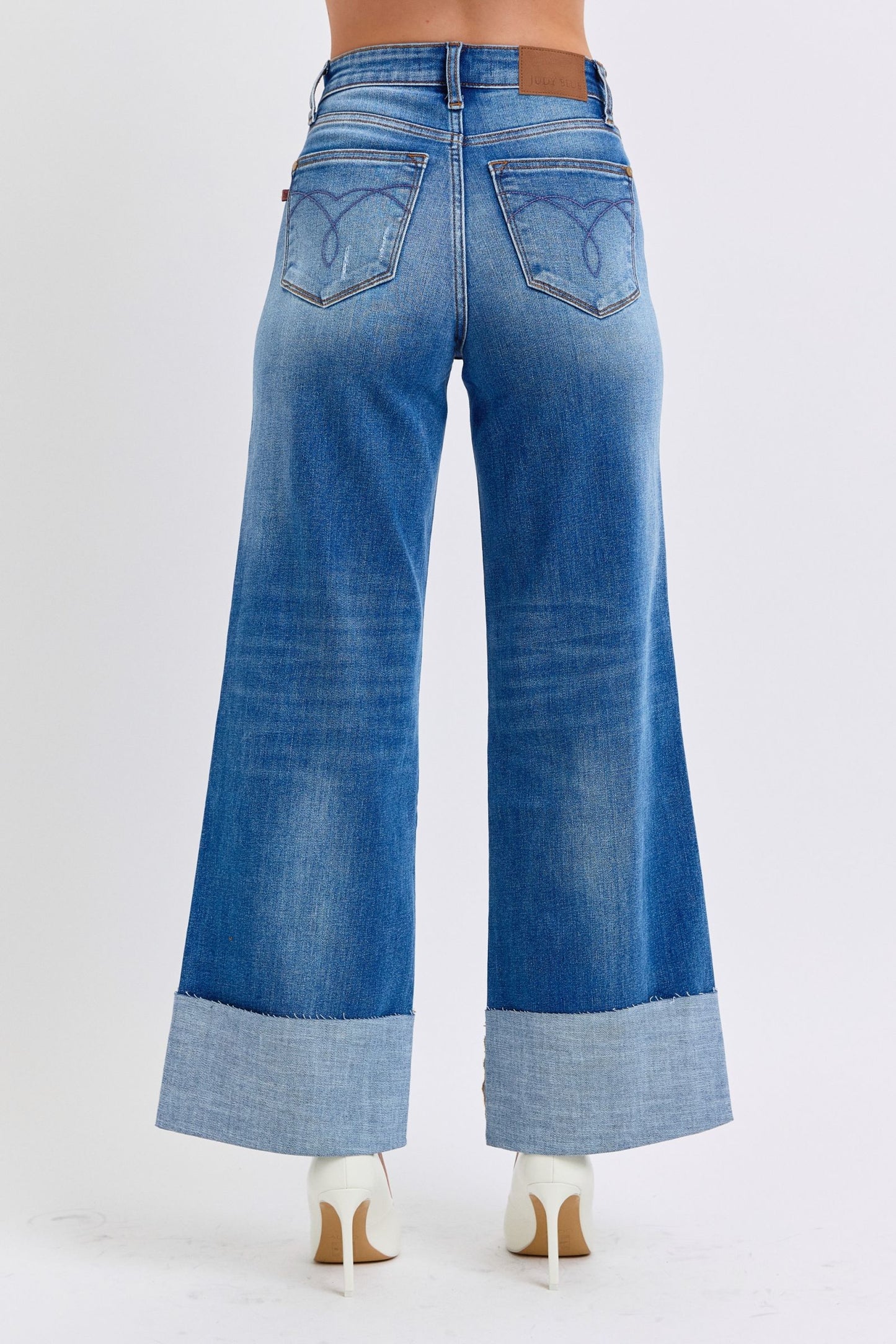 Back view of plus size Judy Blue Nare Wide Leg Jeans with pockets and distressed details.