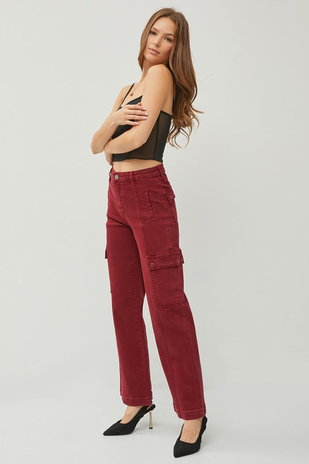 Side angle view of Rafaela wine wide leg cargo jeans showing cargo pocket detail and modern wide leg.